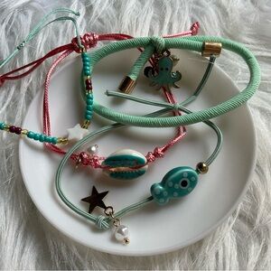 4 ocean theme bead/string bracelet set with shell, octopus, fish, and stars